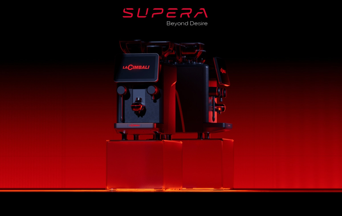 LaCimbali Supera espresso machine lit in red against a dark backdrop.
